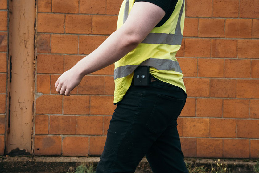 Man walking illustrating product on belt