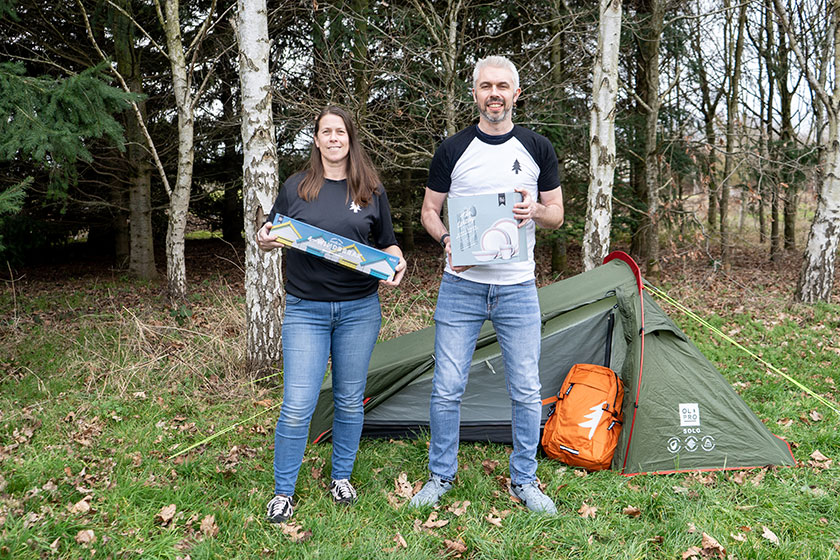 Man and woman with camping gear